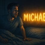 A startled man sits upright in bed, gazing at his glowing name “MICHAEL” on the wall.